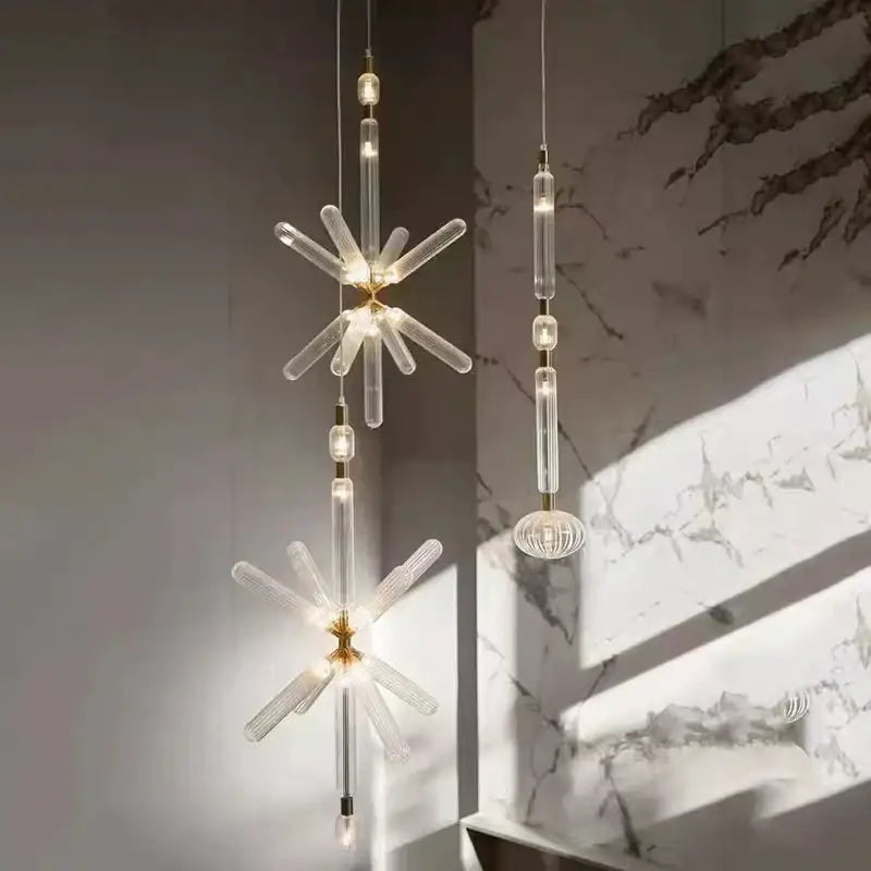 Decorbites glass tubes led chandelier featuring modern starburst design with gold metal and clear faceted crystal arms