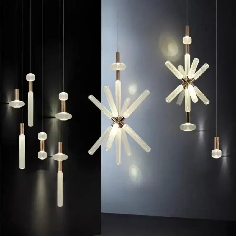 Modern minimalist DecorBites glass tubes LED chandelier with frosted glass arms and brass accents in starburst design