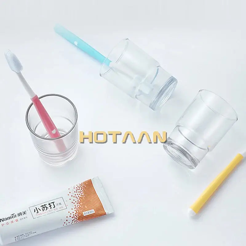 Clear plastic tumbler cup toothbrush holder with pink handle and white bristles by decorbites glass tumbler yt-97