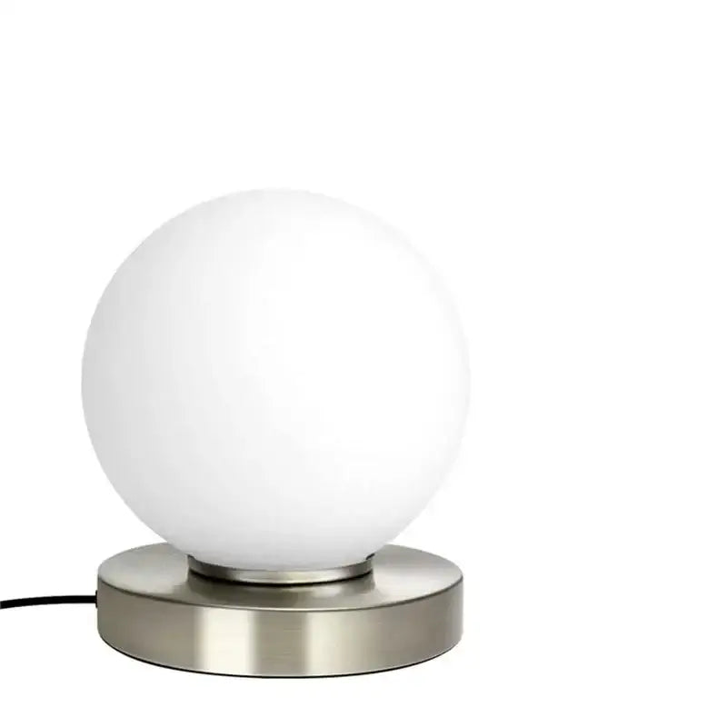 A sleek decorbites glass usb bedside lamp with frosted white globe and brushed stainless steel base for bedroom decor