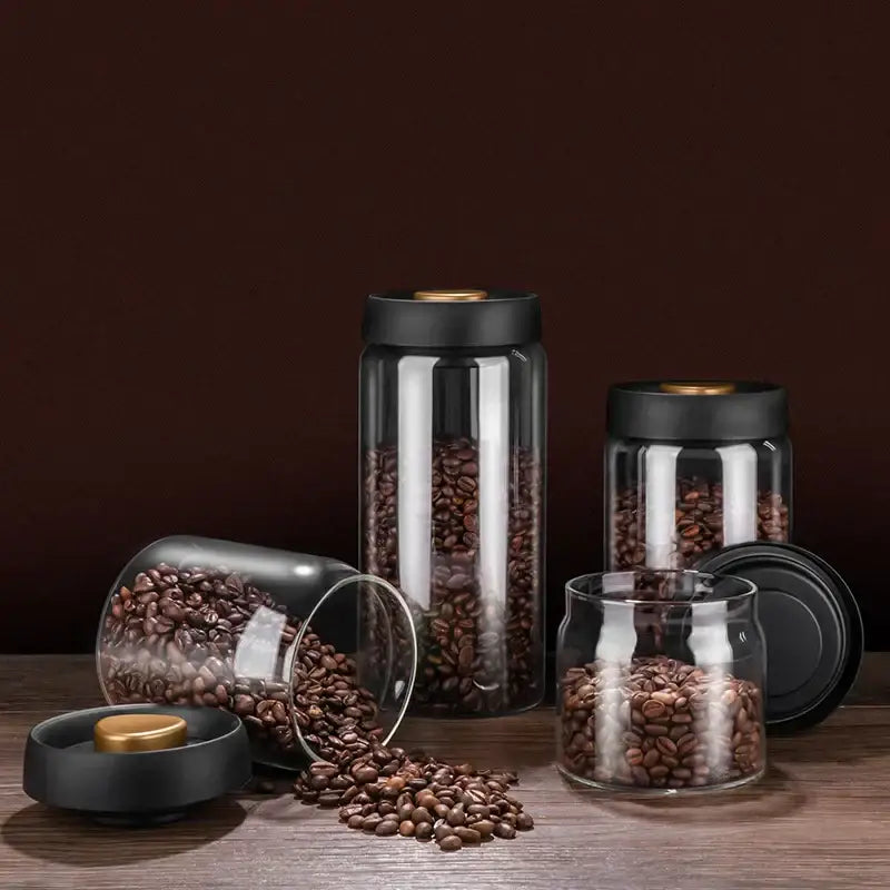 Clear glass coffee bean storage jars with black lids and gold-toned seals for decorbites glass vacuum sealed canisters