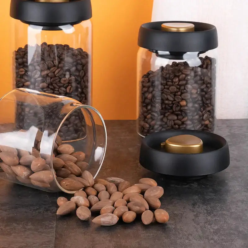 Decorbites glass vacuum sealed coffee beans canister clear glass jar with black lids and gold-toned inner seals