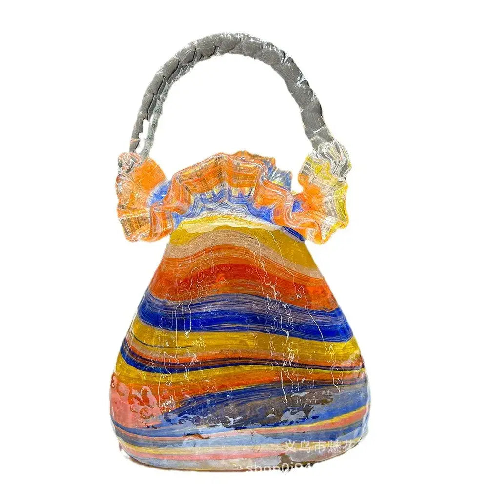 Vibrant decorbites glass vase basket handbag with swirling orange yellow blue red stripes and twisted silver handle