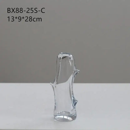DecorBites glass vase shaped like a stylized tree trunk with smooth curves and branch-like protrusions for floral arrangements