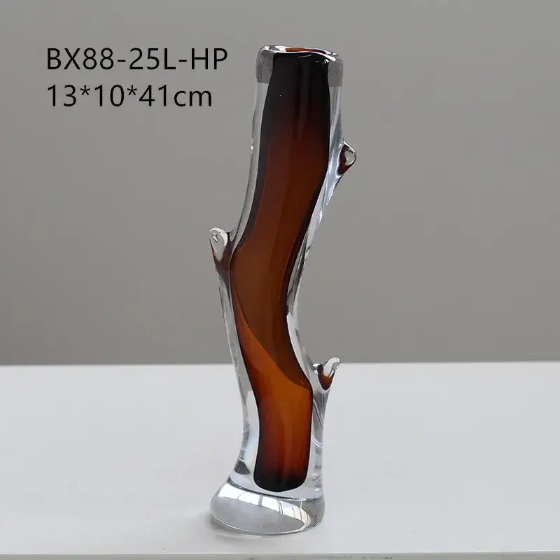 A sleek decorbites glass vase with amber gradient and sculpted branch details for floral arrangement or terrarium