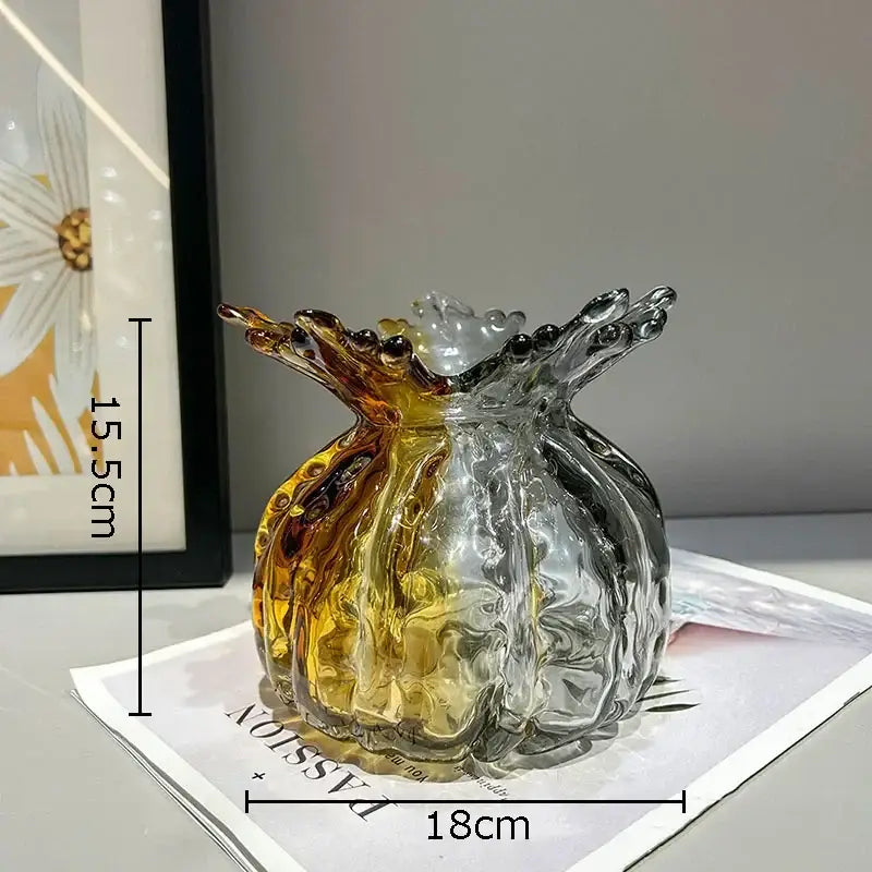 Translucent amber and clear decorbites glass vase shaped like a pomegranate with textured fruit segment ridges for decor