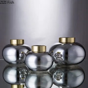 Set of three sleek metallic finish decorbites glass vases with polished gold lids ideal for glass vase desk decoration