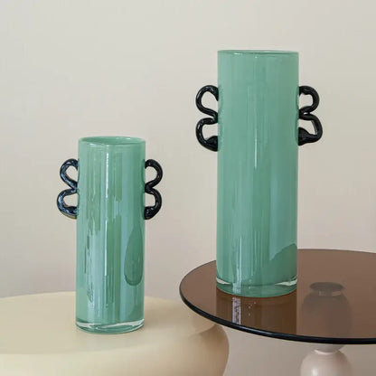 Tall translucent mint-green decorbites glass vase with sleek black twisted handles for home decoration and terrariums