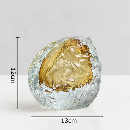 Translucent decorbites glass vase with icy blue outer layer and golden interior featuring elegant wrinkle design
