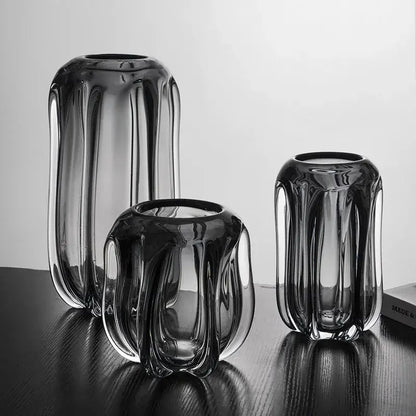 Set of three decorbites glass vases with dark tinted, vertical ridged textures and glossy finish for home decor accent