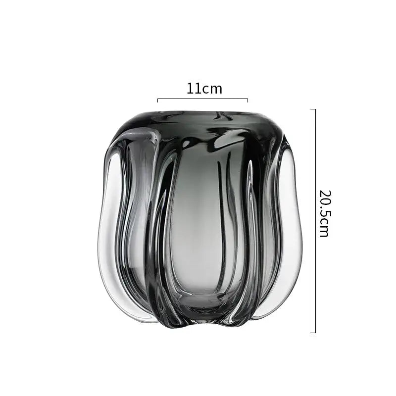 A sleek dark gray glass vase with sculpted ribbed design and smooth curves by decorbites glass vase for home decor accents