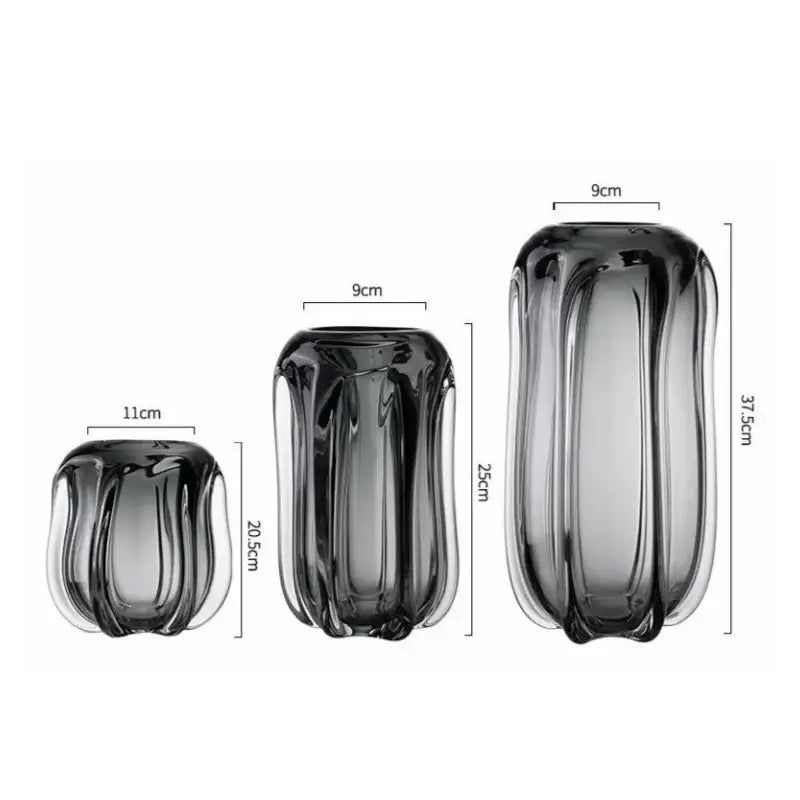 Set of three sleek ribbed decorbites glass vases in dark gray to translucent hues for hydroponics and flower arrangement