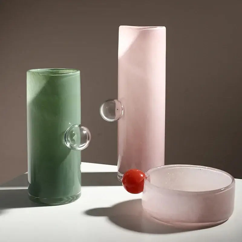 Pastel pink DecorBites glass vase geometric with translucent glass, clear spherical handle, and red cherry accent