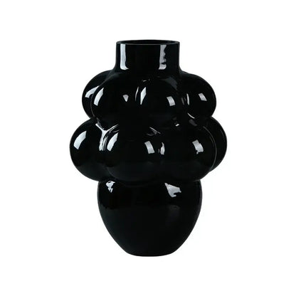 A glossy black decorbites glass vase with a unique bubbly grape geometric design for home decoration and hydroponic planting