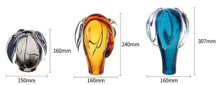 Three glass elephant figurines in black amber and blue with translucent bodies featured in decorbites glass vase hot air balloon home decor accessory