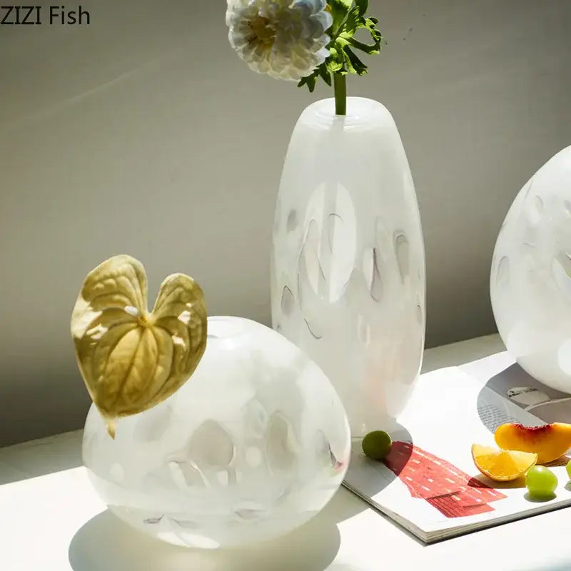 White frosted decorbites glass vase with tall slender shape and abstract cut-out patterns for elegant table decor