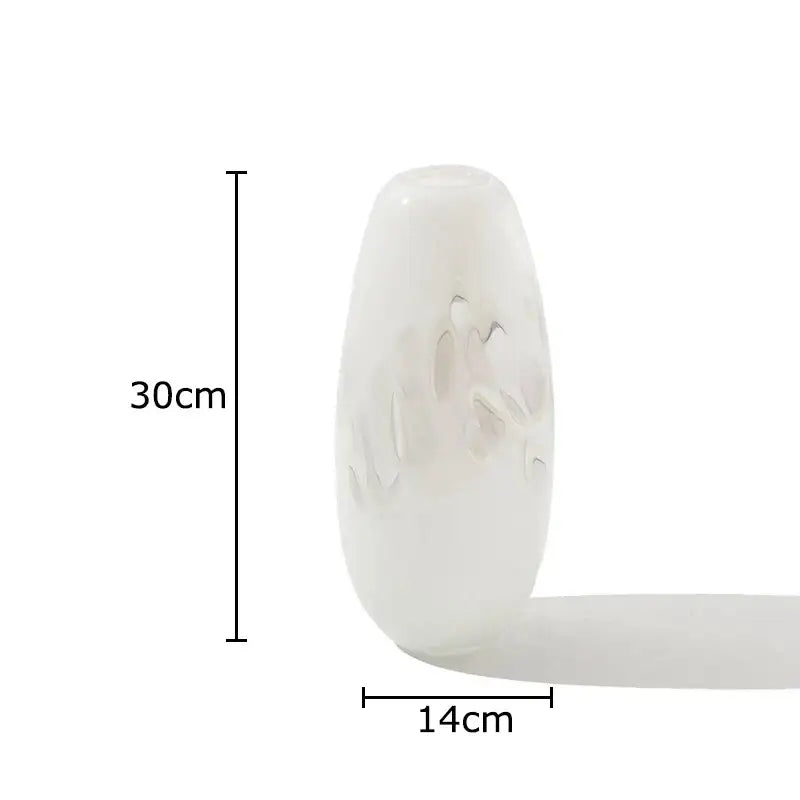 A translucent white decorbites glass vase with frosted floral etchings and a smooth rounded silhouette for elegant decor