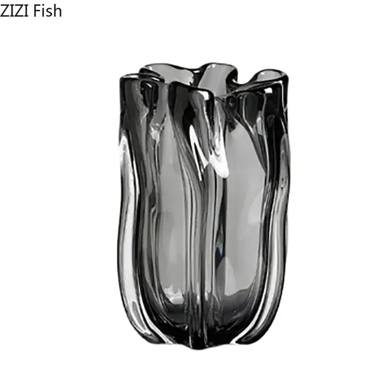 A sleek dark gray decorbites glass vase with wavy sculpted design and vertical ridges for hydroponics desk decor