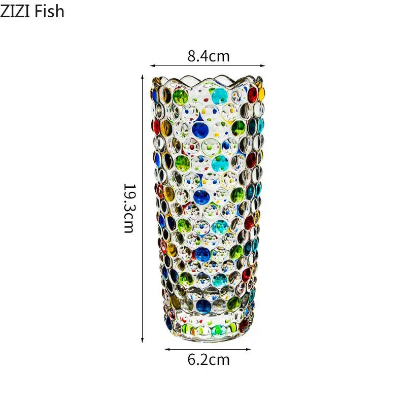 A tall clear decorbites glass vase adorned with colorful round gemstones for flower pots and glass vase hydroponics use