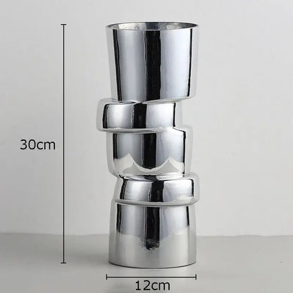 Shiny chrome DecorBites glass vase with twist shape stacked interlocking ring segments for hydroponics decor