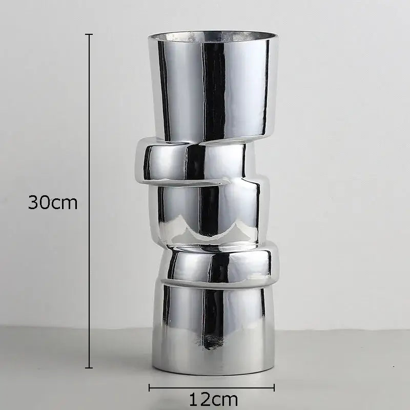 Shiny chrome DecorBites glass vase with twist shape stacked interlocking ring segments for hydroponics decor