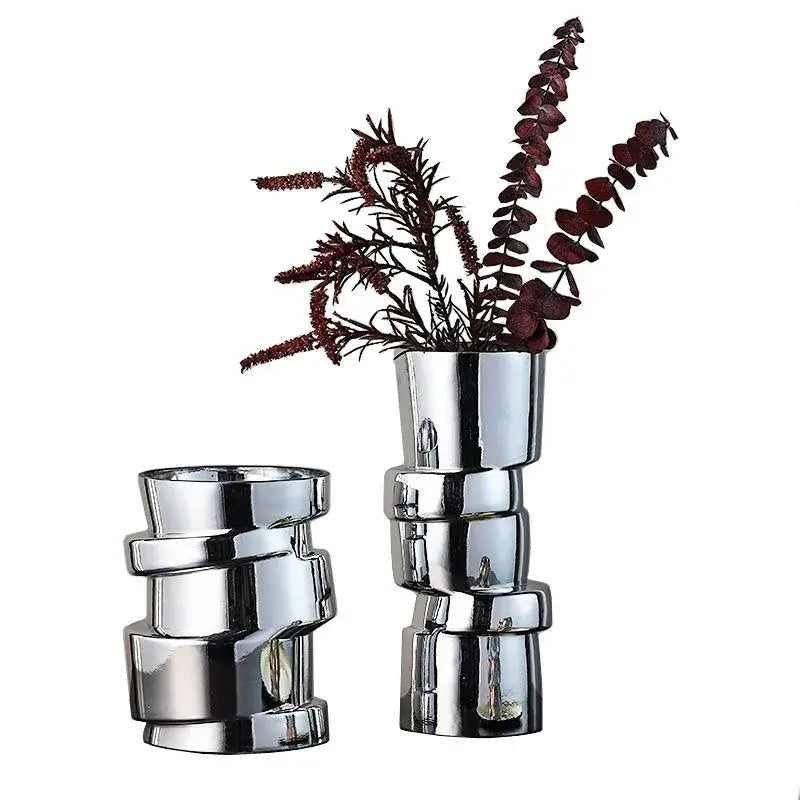 Shiny chrome-finished ceramic decorbites glass vase with stacked geometric cylindrical segments in twist shape design