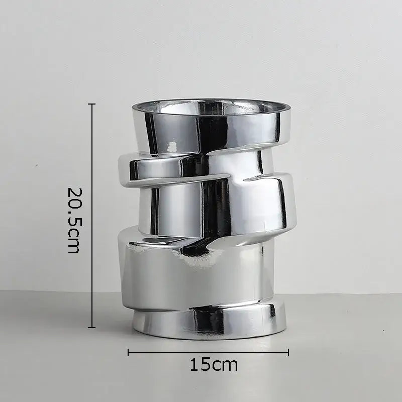Shiny chrome-finished decorbites glass vase in twist shape with stacked ceramic cylindrical segments for terrarium decor