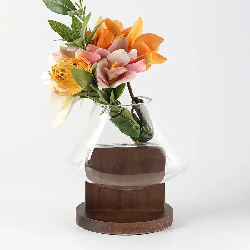 Clear glass DecorBites glass vase terrarium with sleek modern design and wide mouth on dark brown wooden base