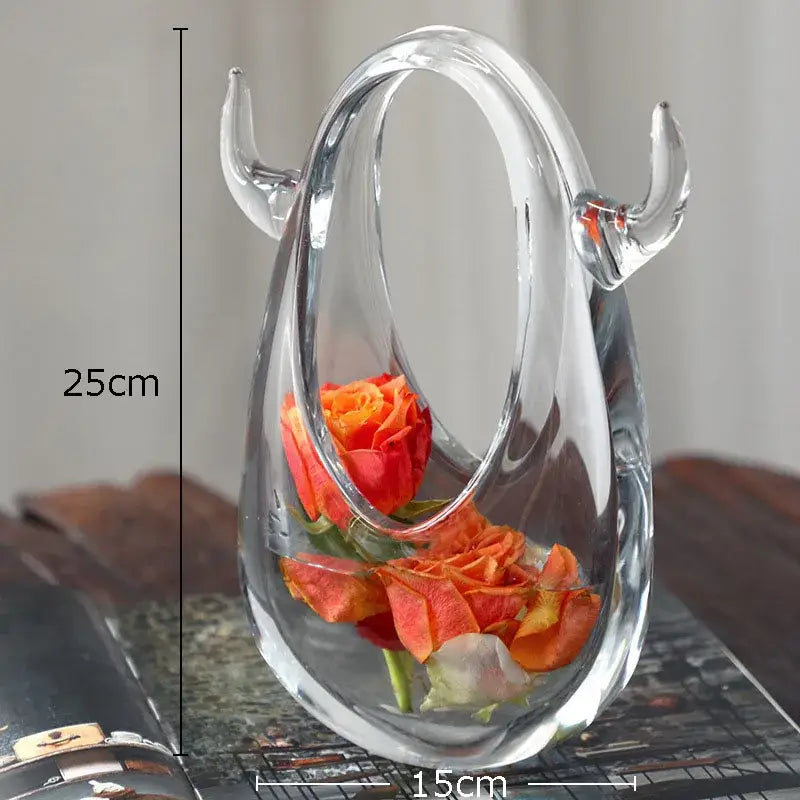Clear glass decorbites glass vase terrarium with curved horns holding vibrant orange roses in water for home decoration
