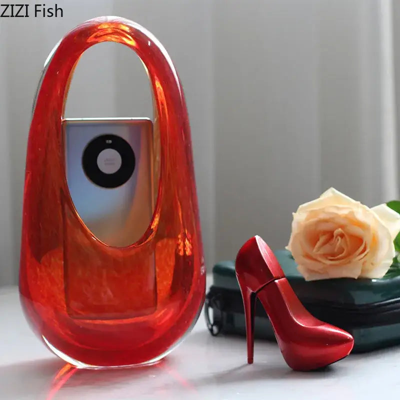 Vibrant red translucent acrylic handbag with sleek modern design complements decorbites glass vase terrarium accessories