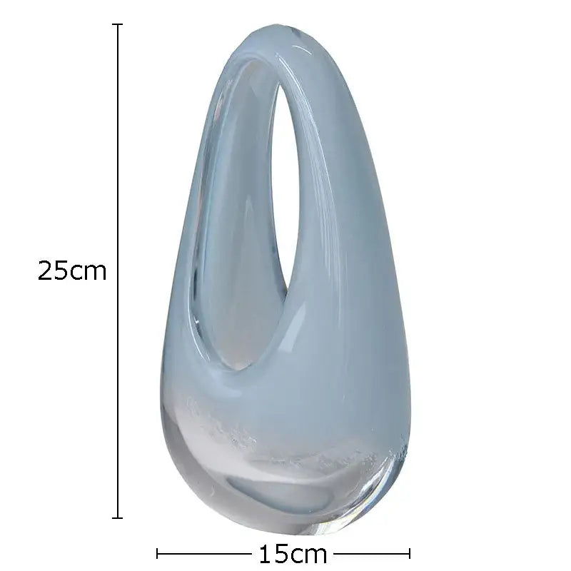 A sleek translucent light blue decorbites glass vase terrarium with a smooth teardrop shape and elegant open loop top