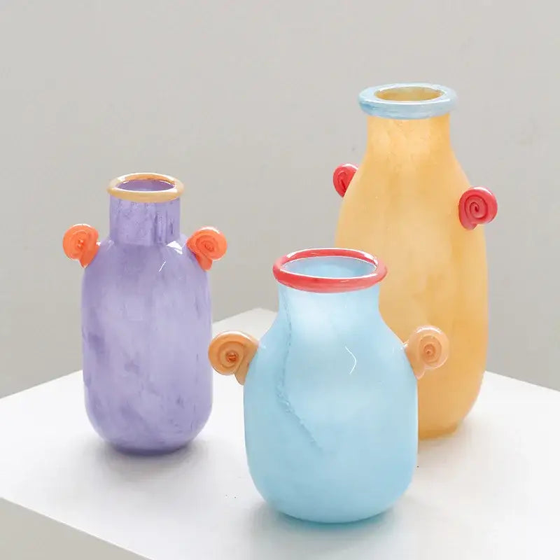 Three colorful decorbites glass vases with swirling candy handle accents for home decor and floral arrangements