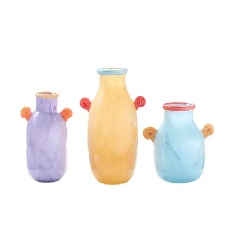 Set of three colorful decorbites glass vases with swirling candy handles and marbled finishes for home decor