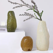 Three textured decorbites glass vases in olive green beige and amber with pebbled surface for flower arrangement and decor