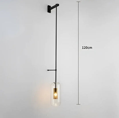 Black metal wall art light with clear glass pendant and exposed bulb for modern loft style living room decor