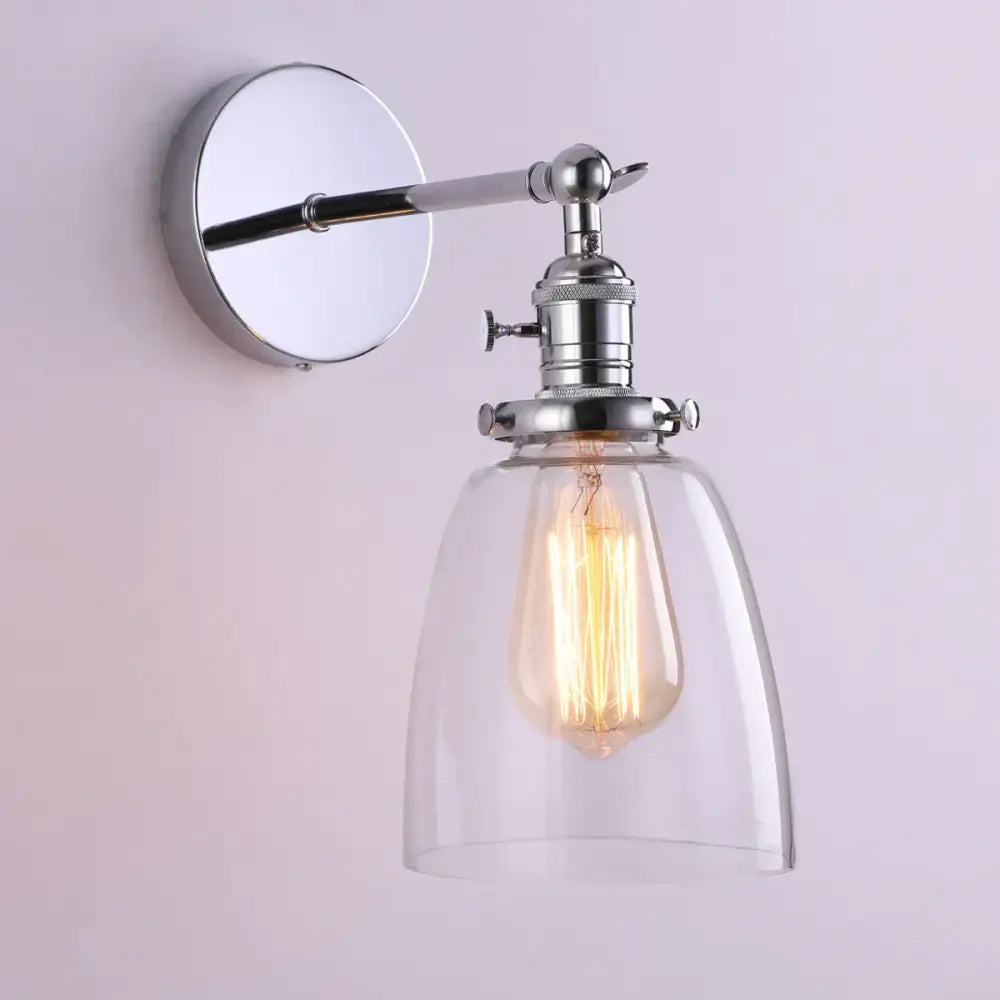 Chrome-finished glass wall lamp with clear glass shade and exposed filament bulb for living room and bedroom lighting