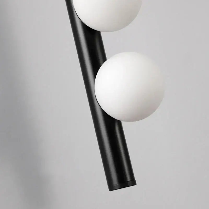 Black decorbites glass wall lamp featuring two white spherical glass shades for clubhouse villa living room and bedroom