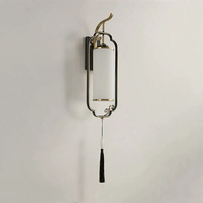 A sleek decorbites glass wall lamp with brass metal frame and off-white glass shade for living room and bedroom
