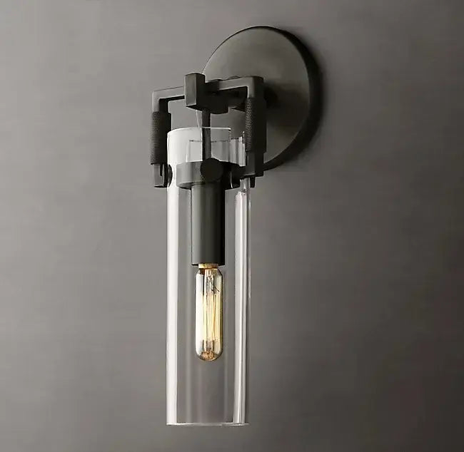Industrial-style decorbites glass wall lamp with matte black metal frame and clear glass housing exposed filament bulb