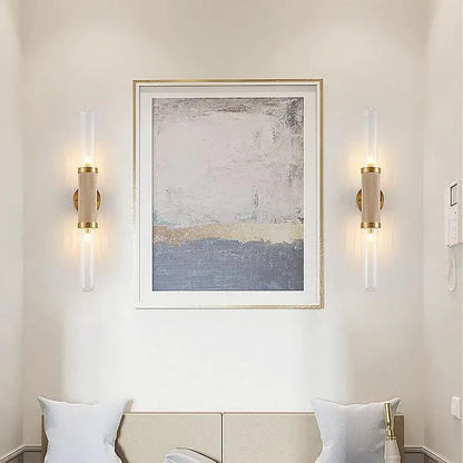 Gold-toned DecorBites glass wall lamp with clear glass tubes and beige cylindrical shades LED light for home decor
