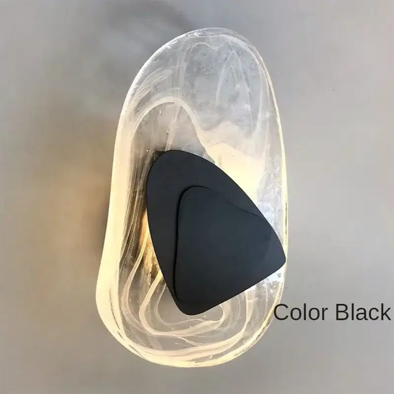 Black insole with a smooth matte finish inside a container accompanying the decorbites glass wall lamp LED sconce