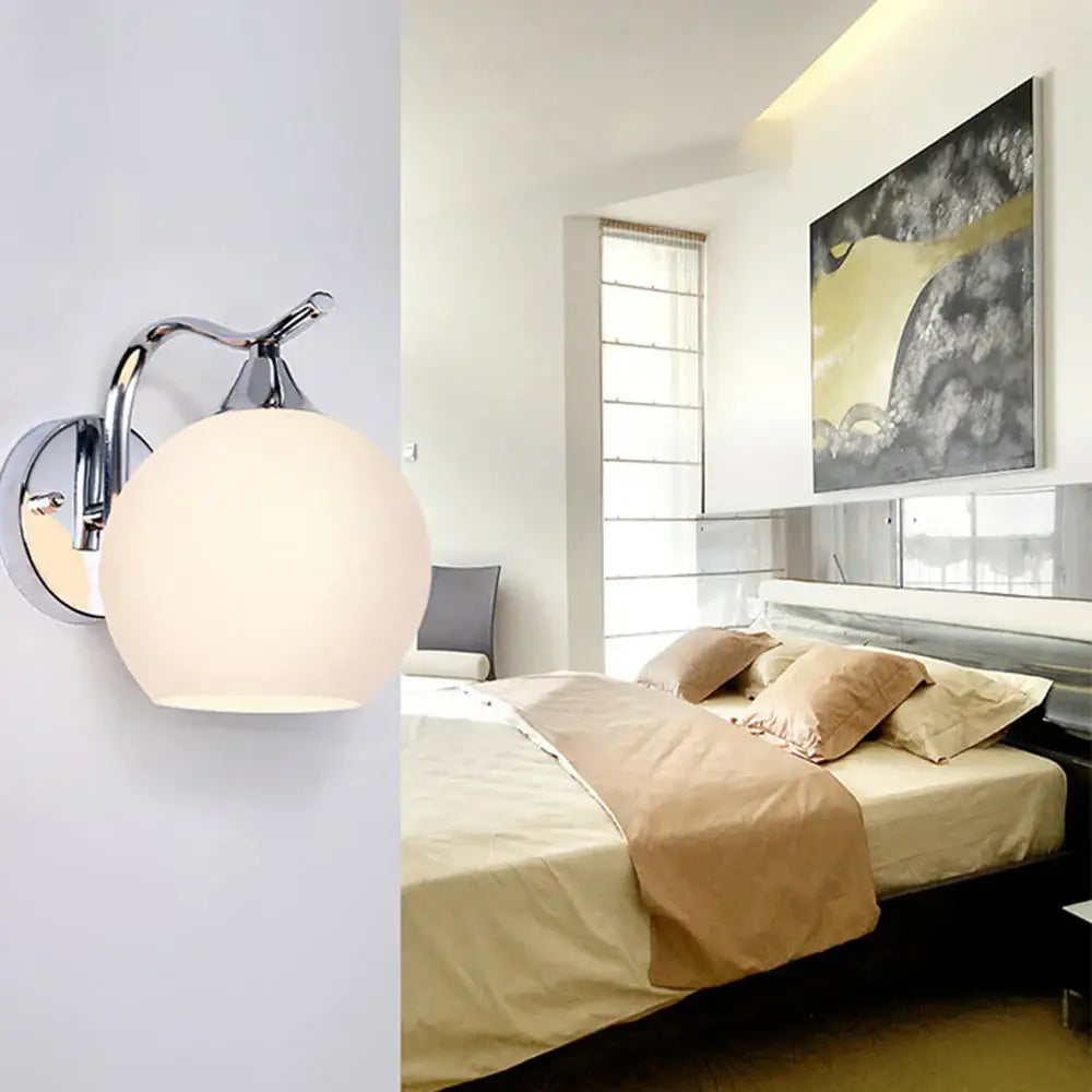 Chrome finished decorbites glass wall sconce with frosted white spherical glass shade for modern luxury lighting