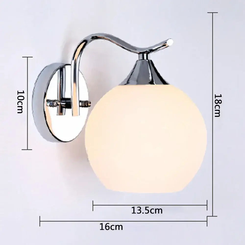 Chrome finished decorbites glass wall sconce with frosted white glass globe for modern luxury bedroom lighting