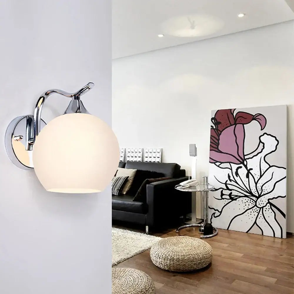Chrome-finished decorbites glass wall sconce with frosted glass globe shade for modern bedroom and corridor lighting