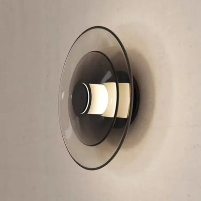 Modern decorbites glass wall lamp with layered translucent glass shades and warm glowing LED for dining or bedroom use