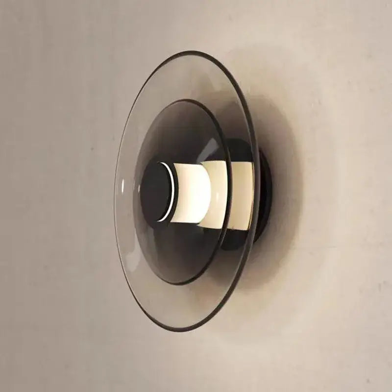 Modern decorbites glass wall lamp with layered translucent glass shades and warm glowing LED for dining or bedroom use
