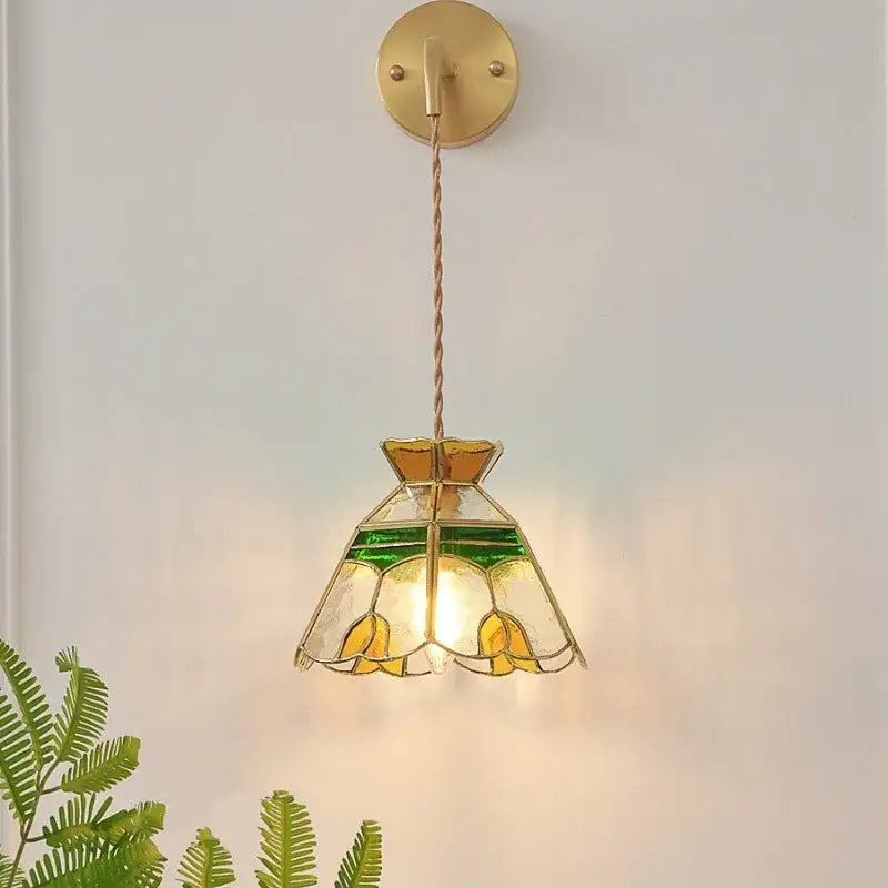 Decorbites glass wall lamp with pull chain switch features a vintage tiffany-style stained glass shade in yellow and green tulips