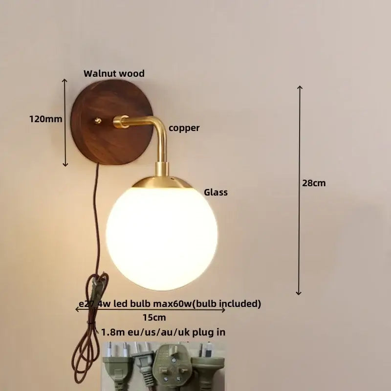 A warm-toned decorbites glass wall light fixture with walnut wood backplate copper arm and frosted glass globe shade