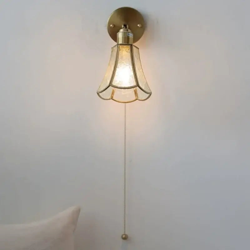 Vintage-style brass decorbites glass wall light sconce with amber textured glass shade and pull chain for modern nordic decor