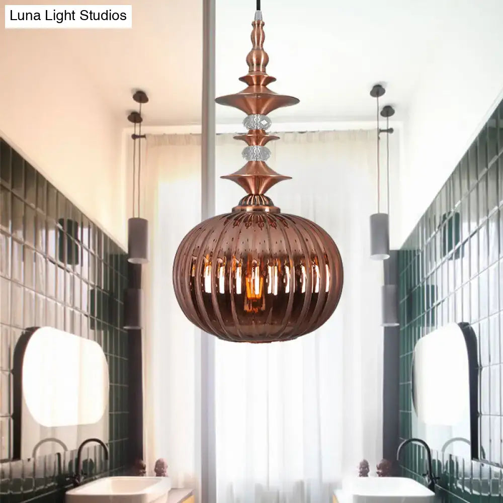 Copper-toned DecorBites pendant light with spherical ribbed glass shade and crystal accents in chrome copper gold finish
